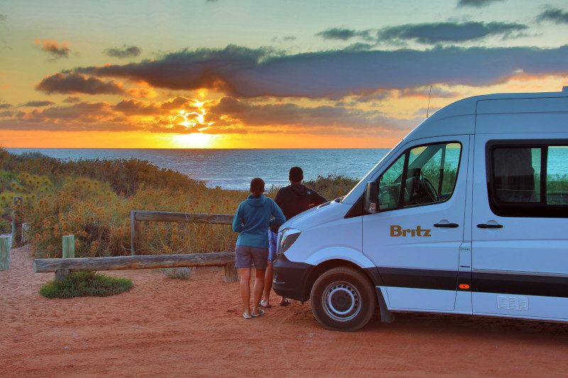 Britz AU Venturer-WA-Sunset Couple2-Exterior-Scenic-Filip Kulise